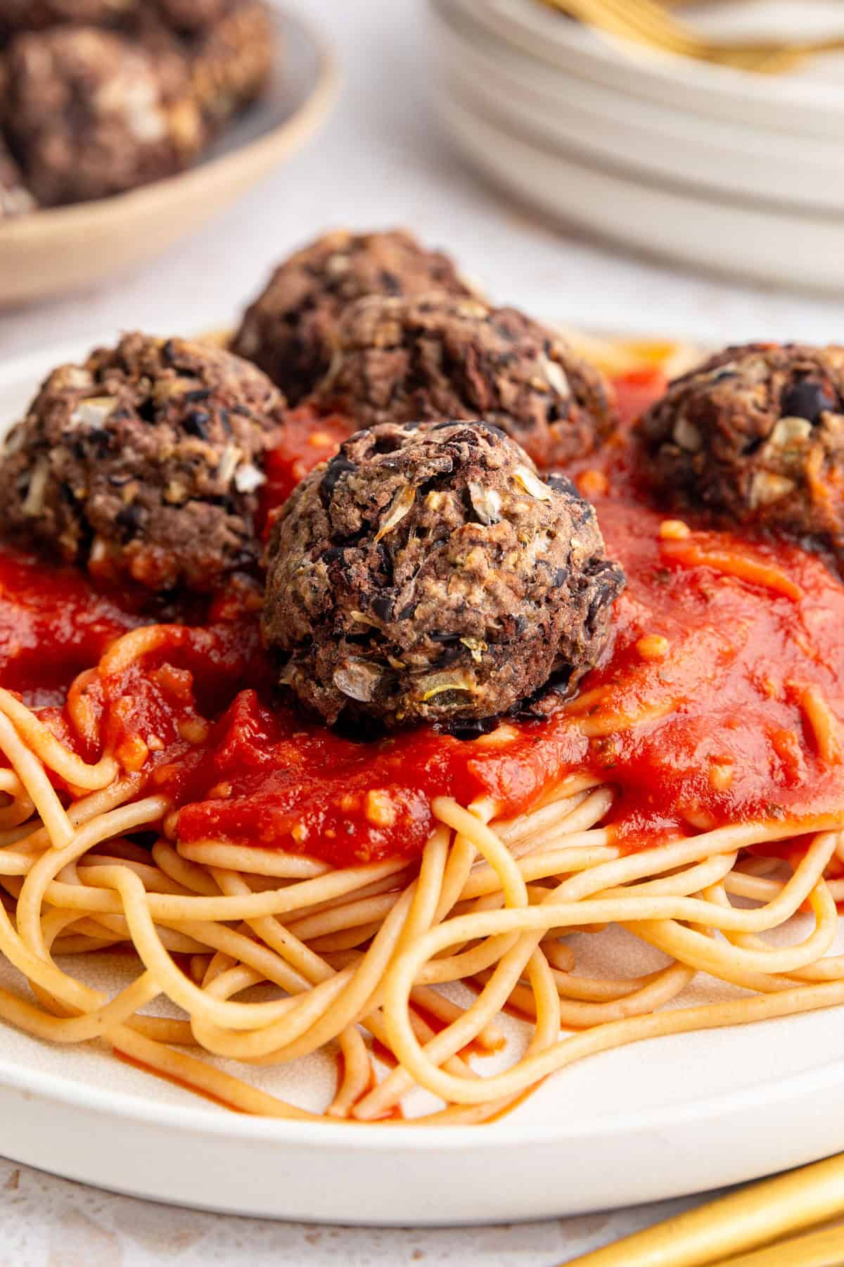 A plate of spaghetti and seitan meatballs.