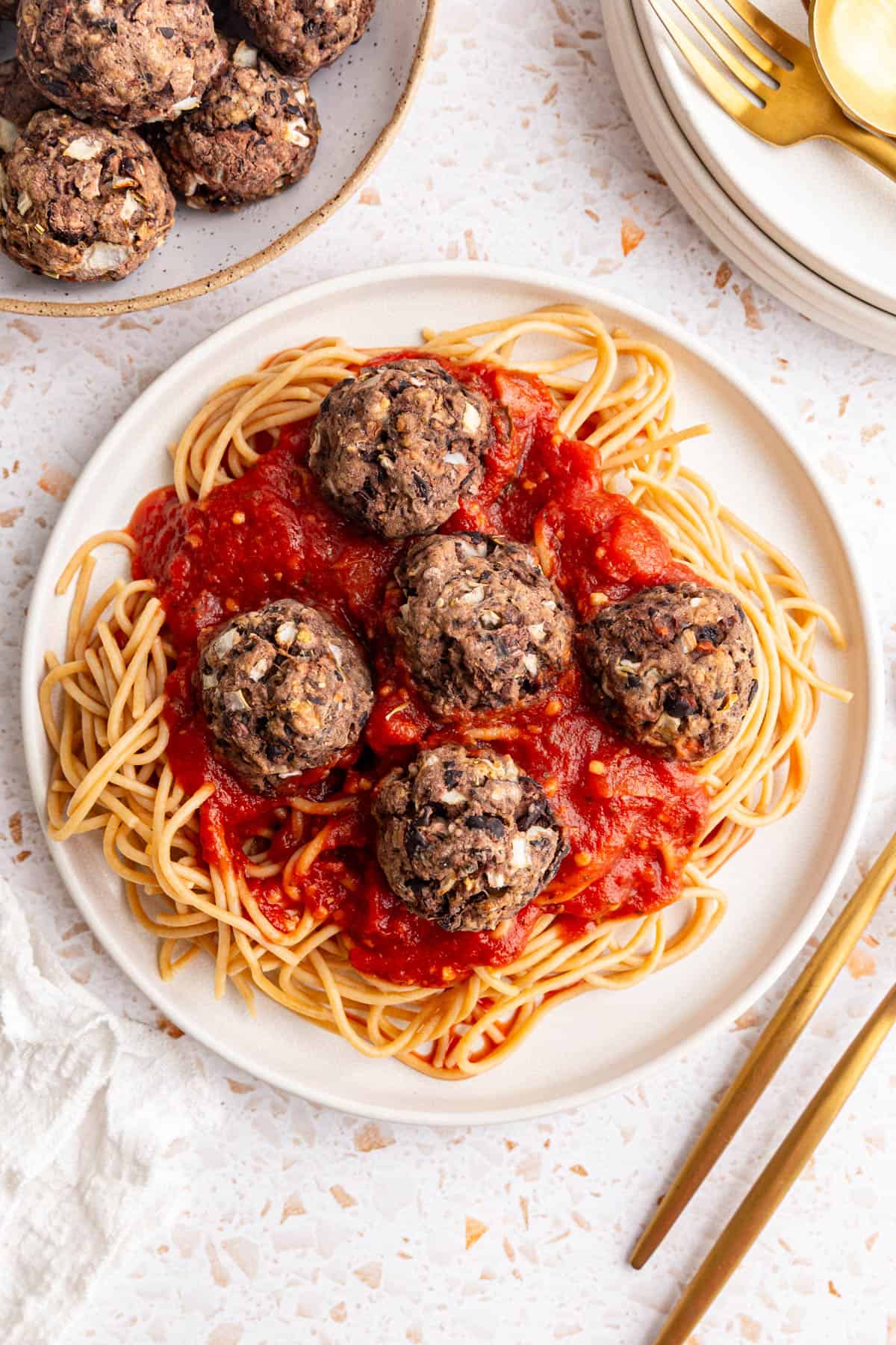 A plate of spaghetti and seitan meatballs.