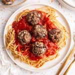 A plate of spaghetti and seitan meatballs.