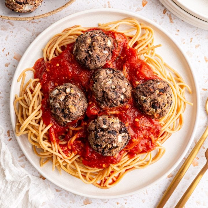 A plate of spaghetti and seitan meatballs.