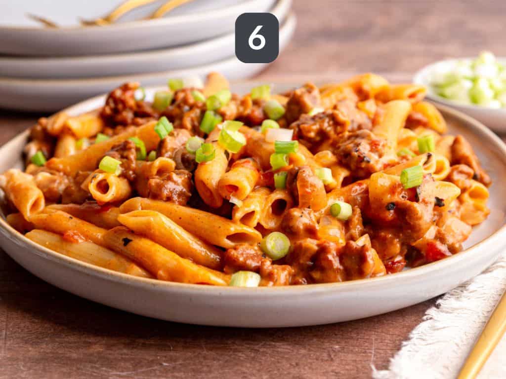 Vegan chorizo pasta step 6 - garnish with scallions.