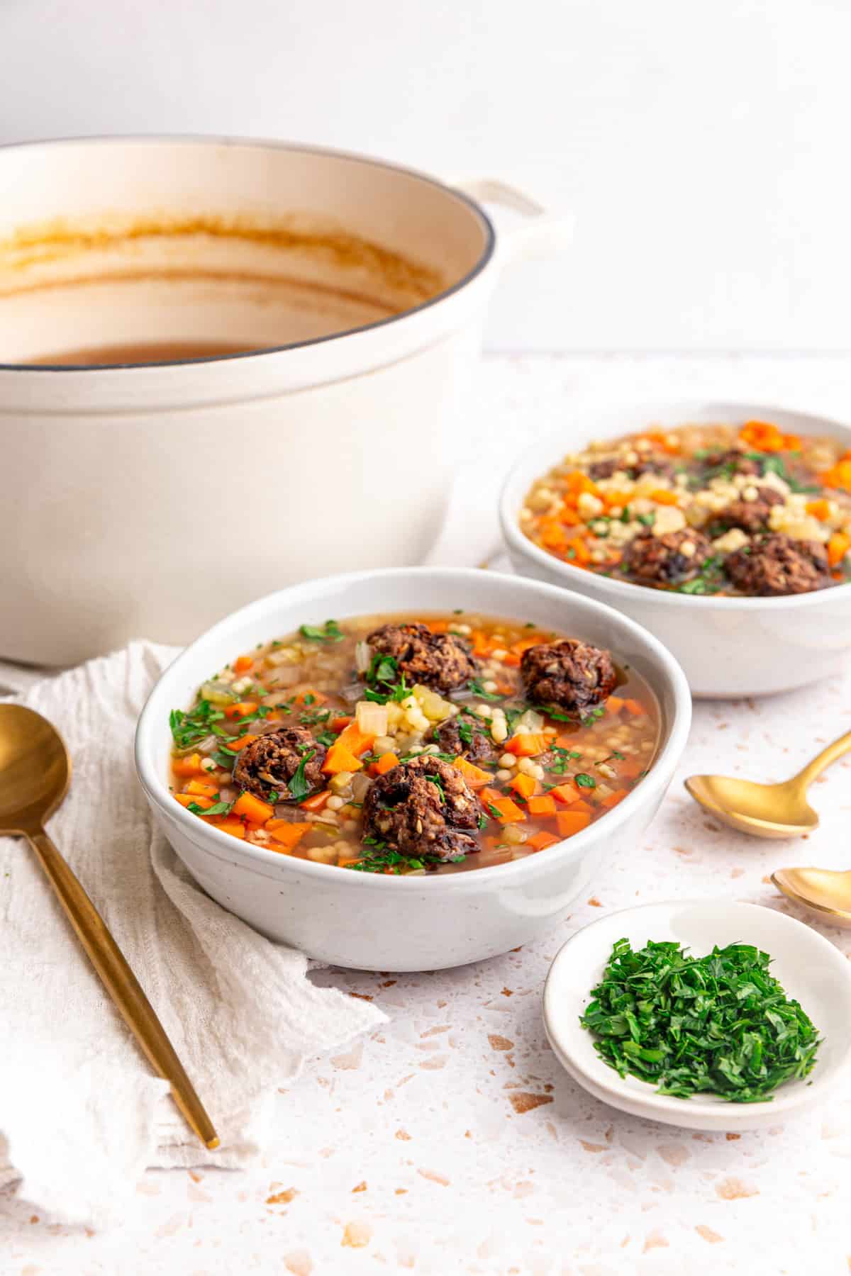 Two bowls of vegan Italian wedding soup.