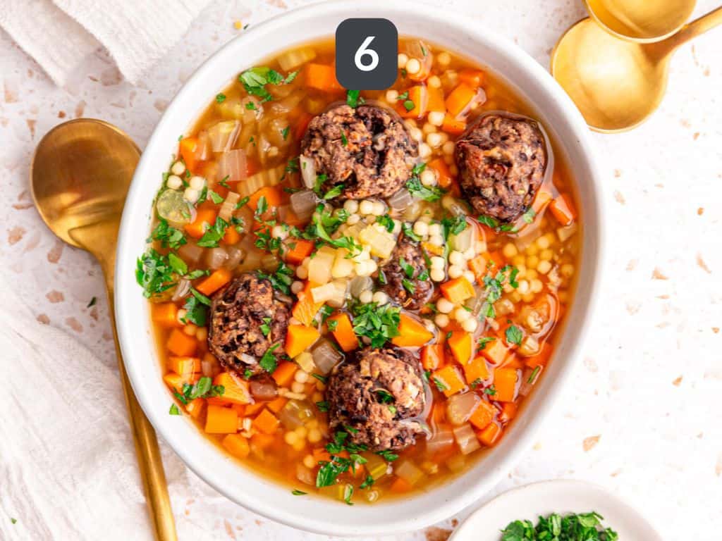 Vegan Italian Wedding Soup Step 6 - serve with meatballs and parsley