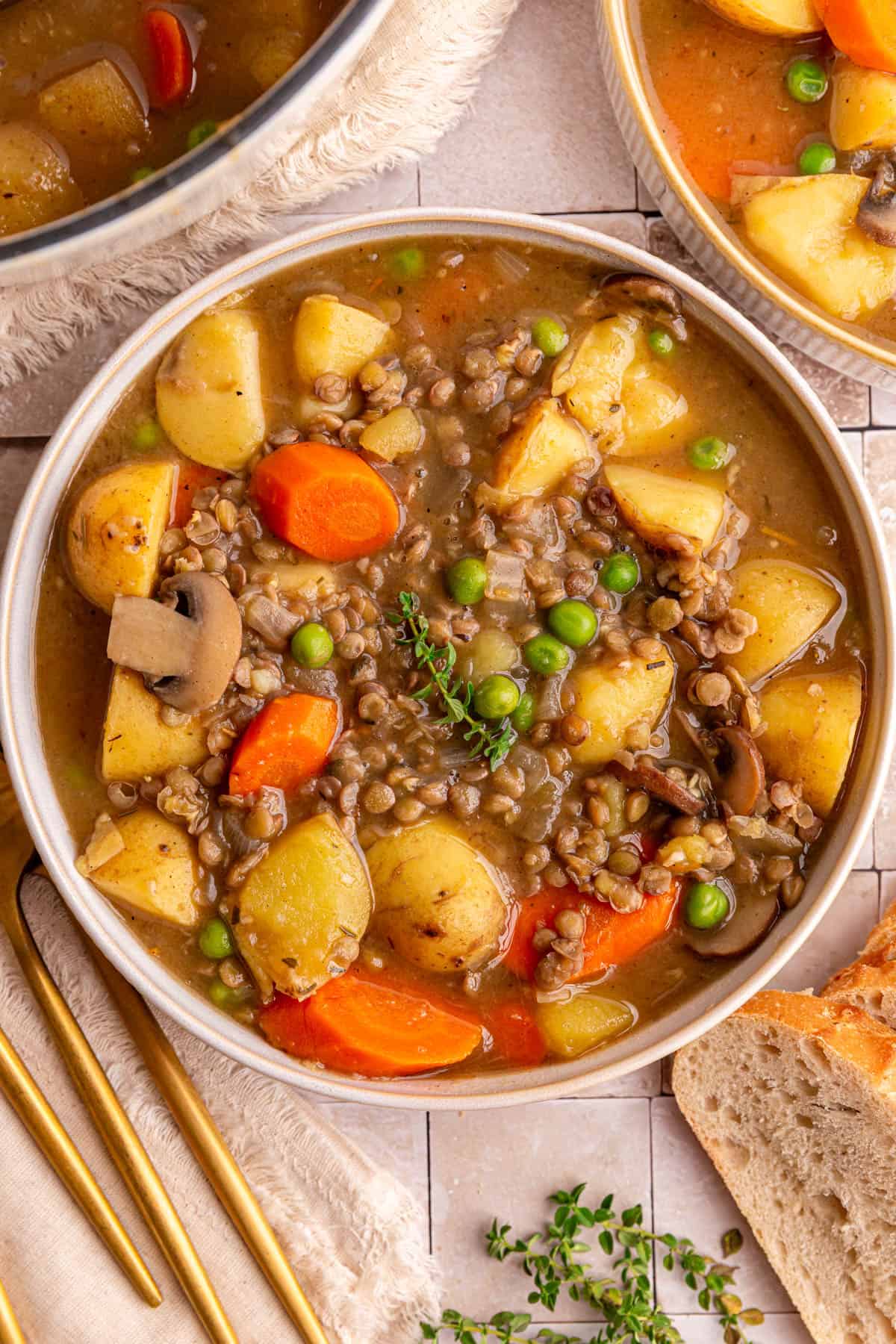 A bowl of vegan potato stew with lentils mixed in.