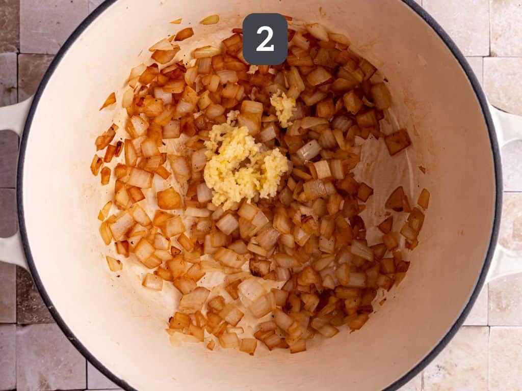 Vegan potato stew step 2 - add the garlic.