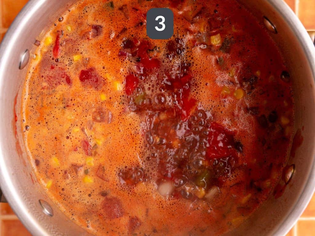 Vegan Southwest Soup Step 3 - add the corn, beans, and liquids.