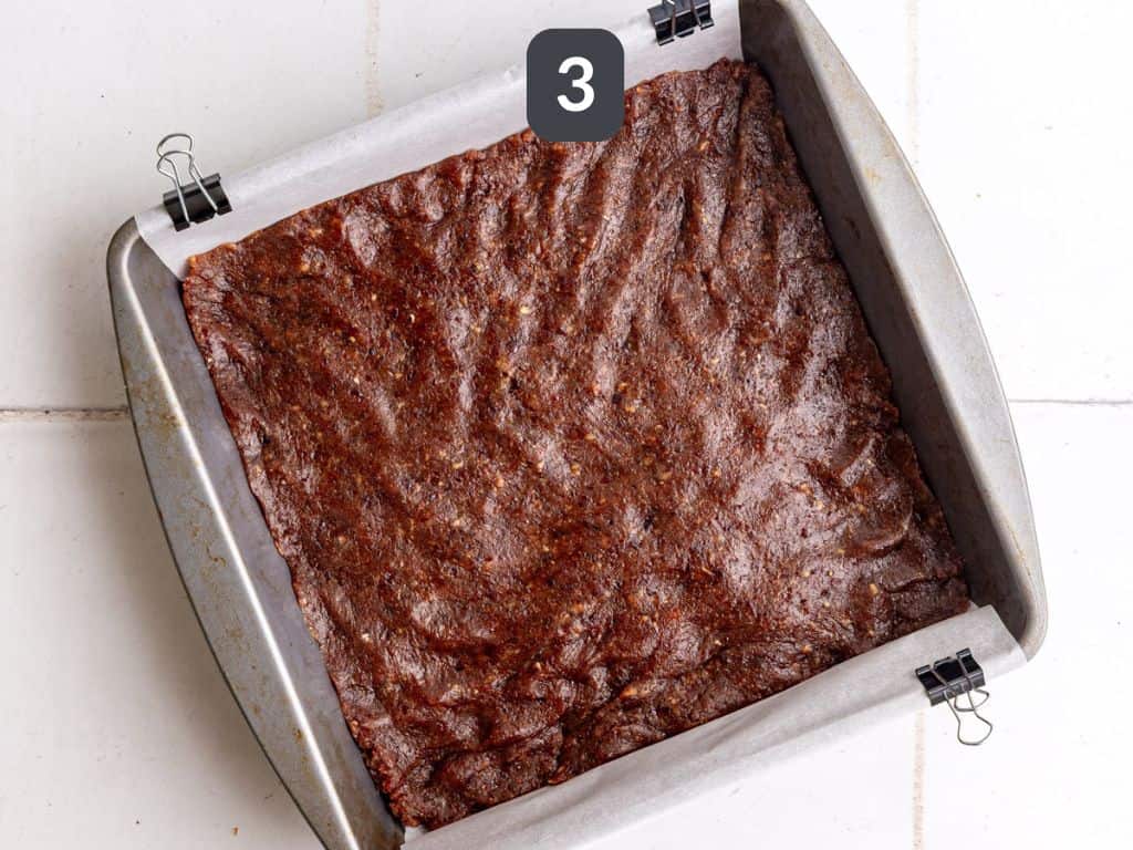 Vegan 100 Grand Bars Step 3 - press the caramel into the pan.