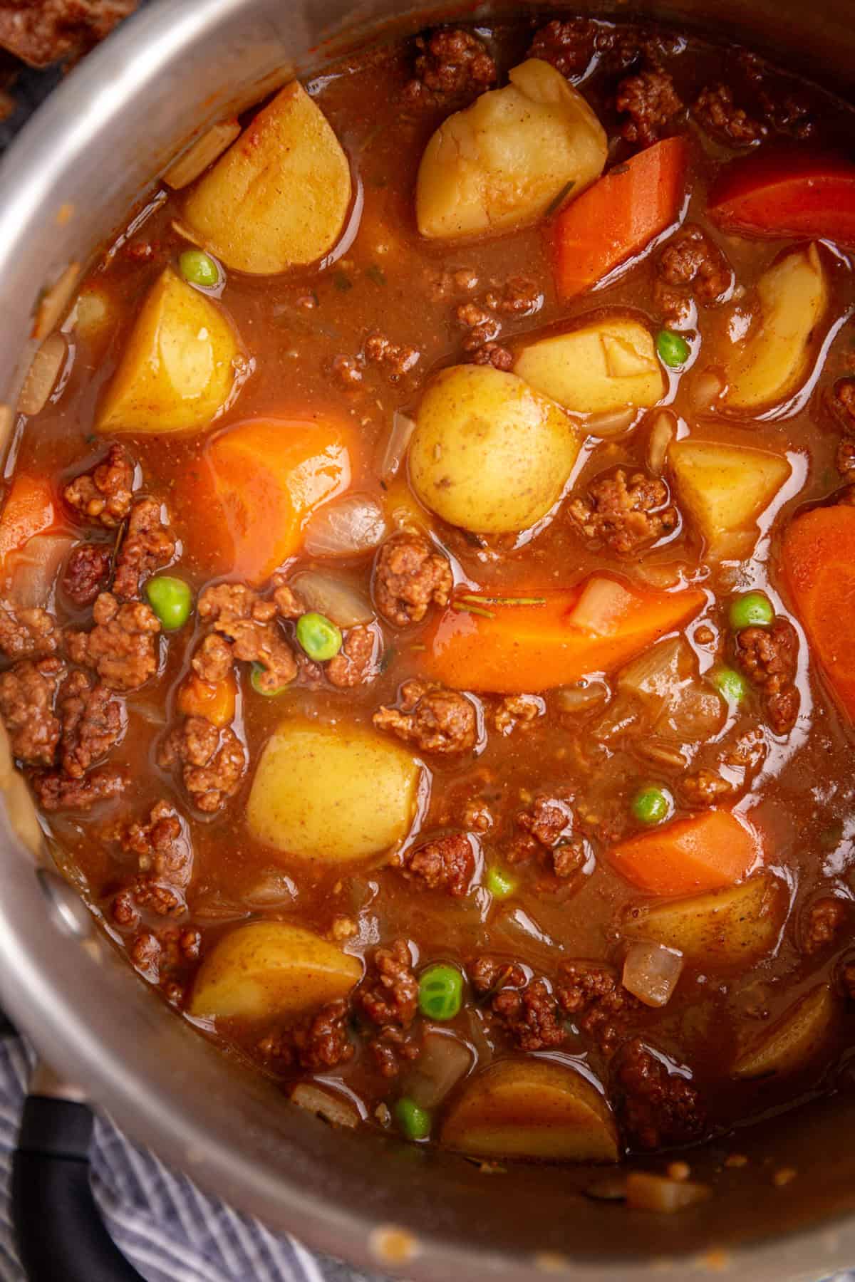 A pot of freshly cooked vegan chorizo stew, ready to serve.