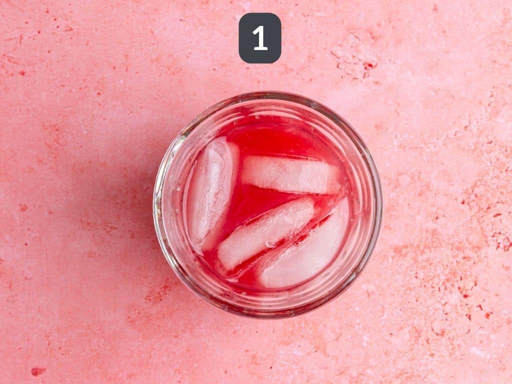 Cosmopolitan mocktail step 1 - mix the ingredients.