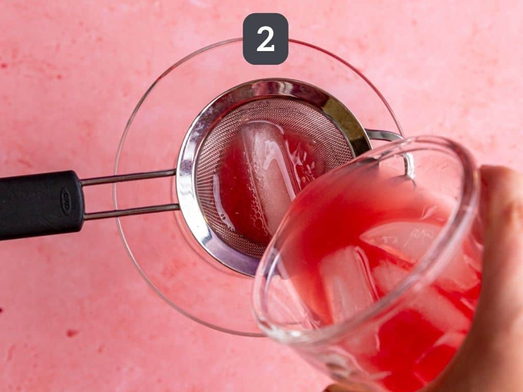 Cosmopolitan mocktail step 2 - strain into a glass