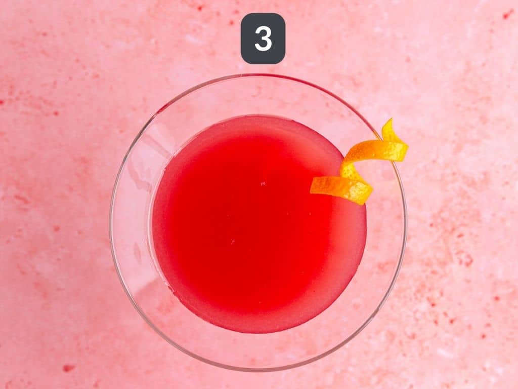 Cosmopolitan mocktail step 3 - garnish with an orange twist
