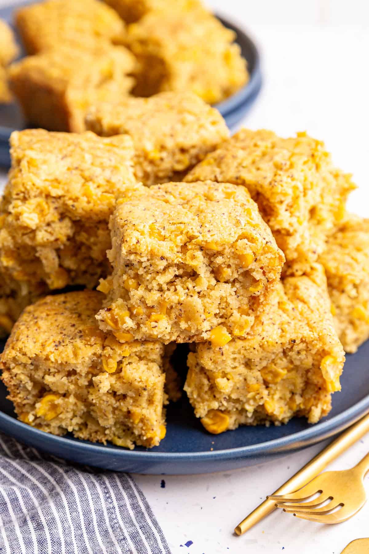 A plate of vegan cornbread casserole slices.
