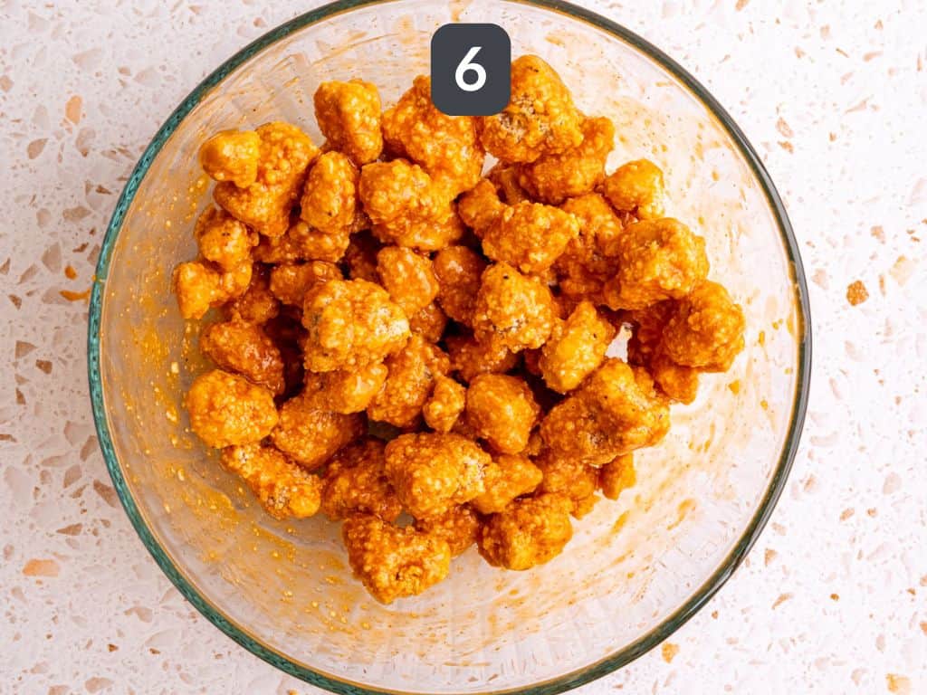 Buffalo Tofu Poppers Step 6 - toss in buffalo sauce