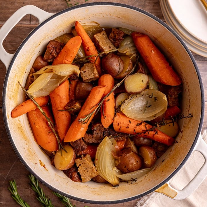 A pot of vegan pot roast, ready to serve.