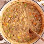 A pot of freshly cooked vegan shepherd's pie soup.