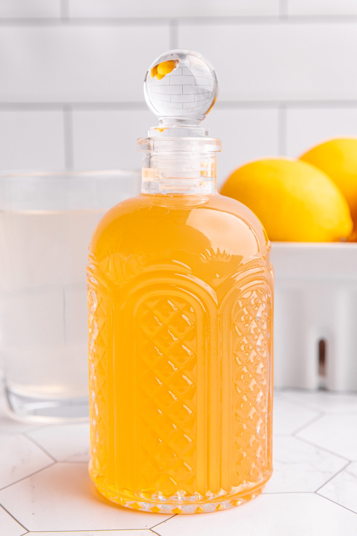A bottle of lemon ginger syrup.