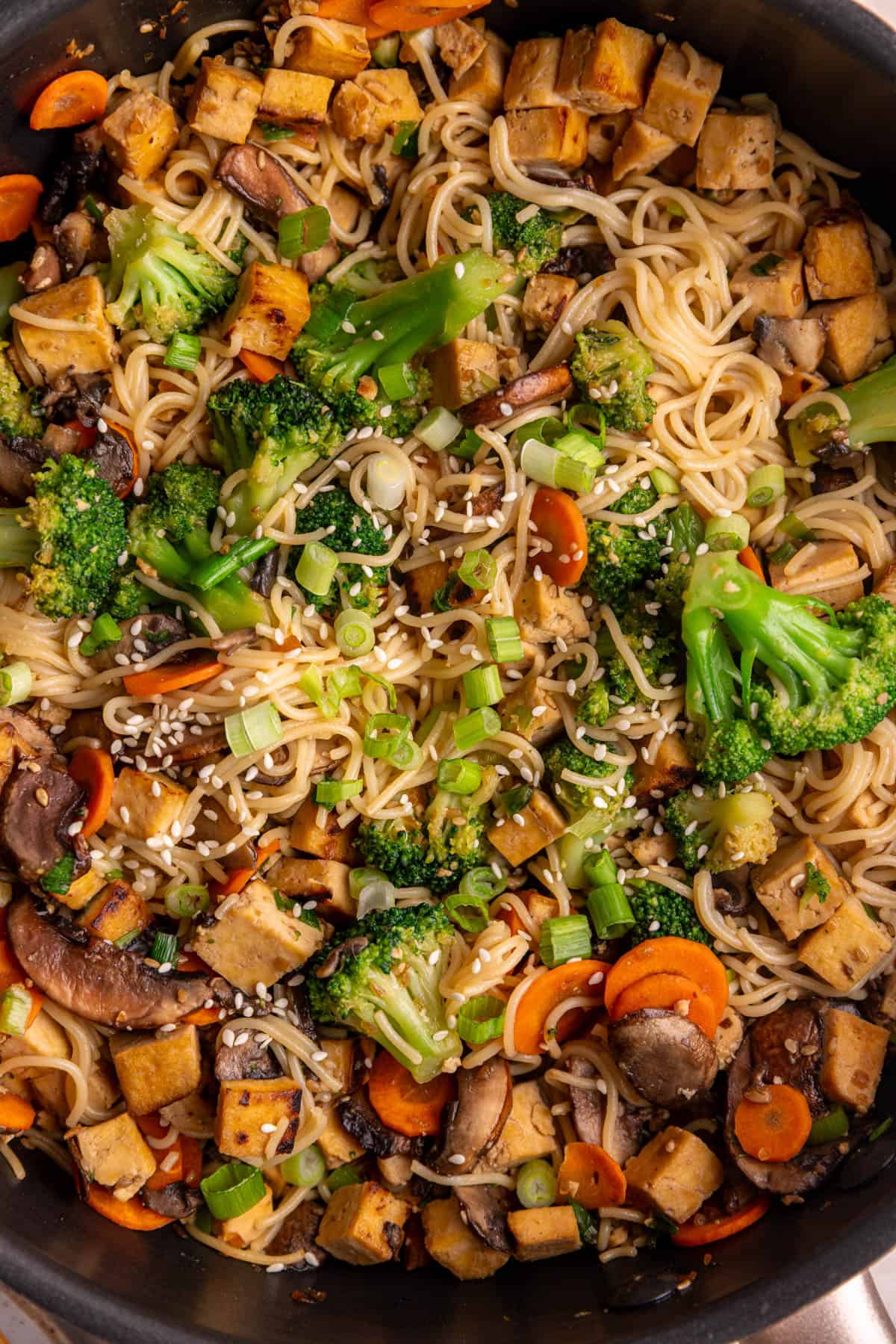 A pan of vegan teriyaki noodles, freshly cooked.