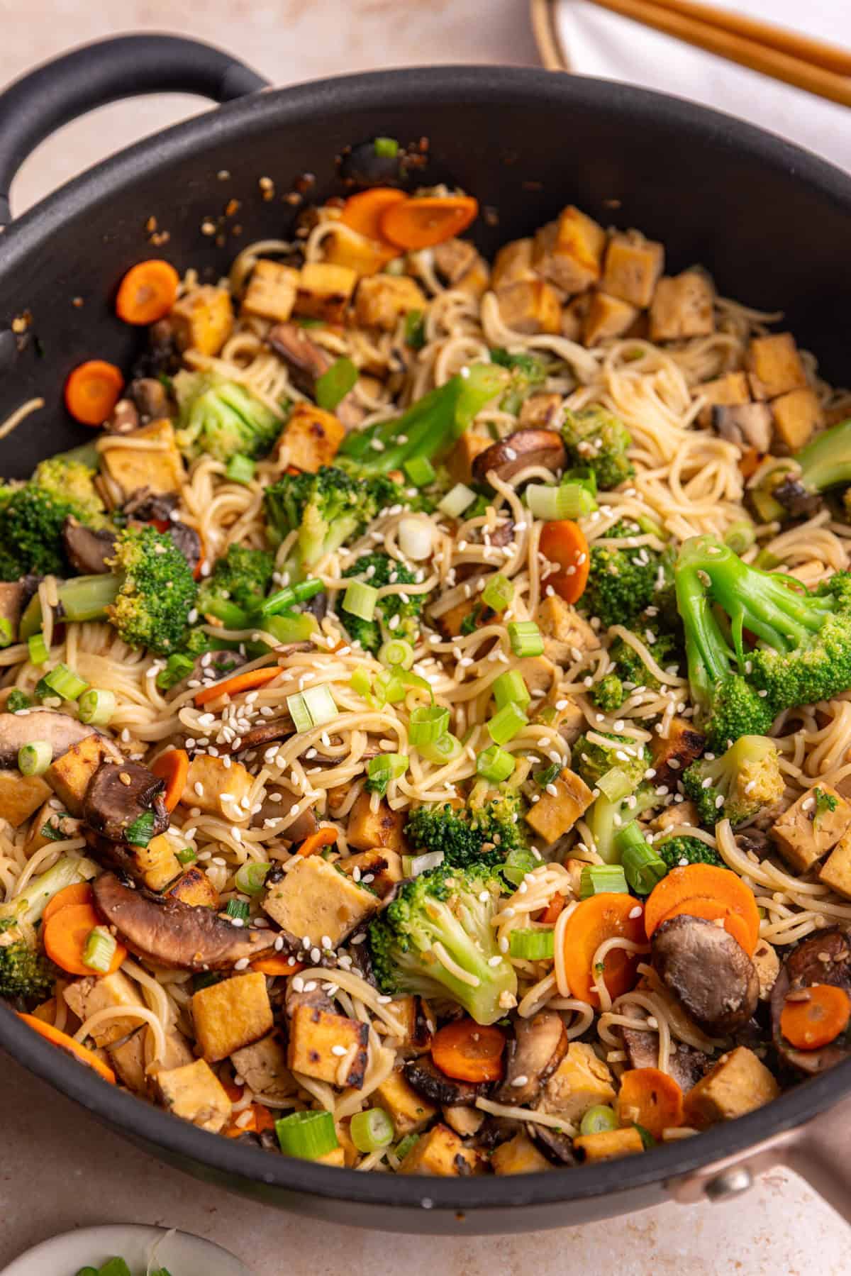 A pan of vegan teriyaki noodles, freshly cooked.