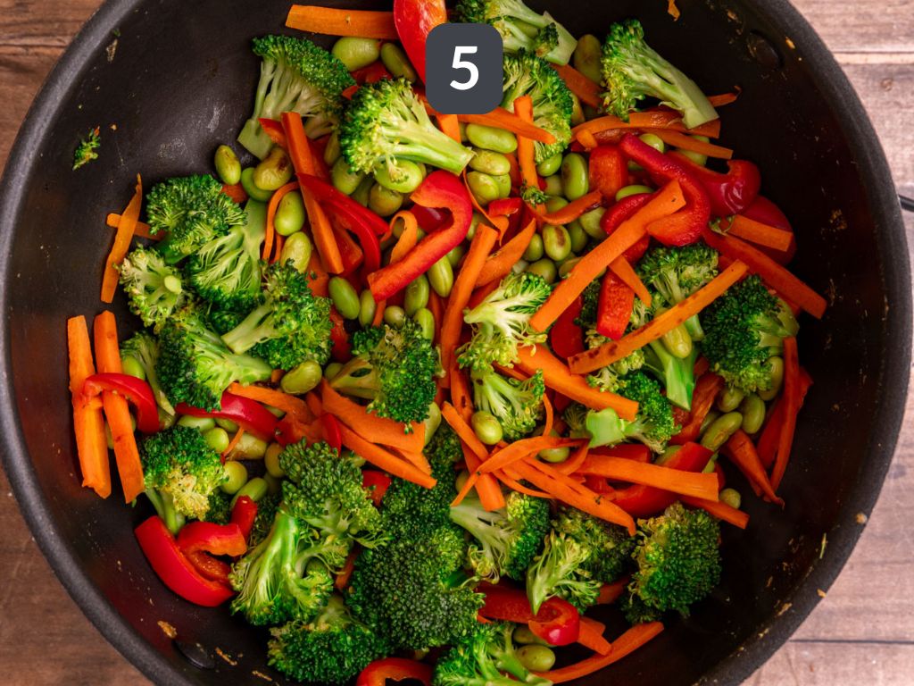 Vegan satay noodles step 5 - pan-cook the vegetables.