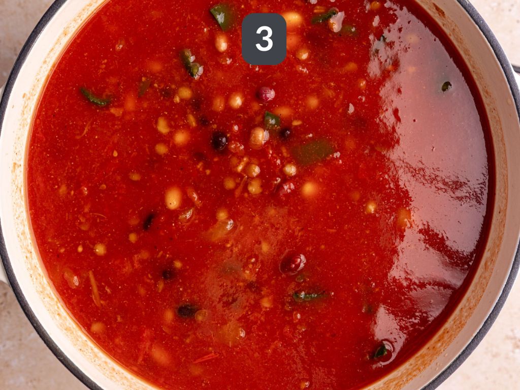 Vegan Five Bean Chili Step 3 - add the beans, tomatoes, and broth, bring to a boil.