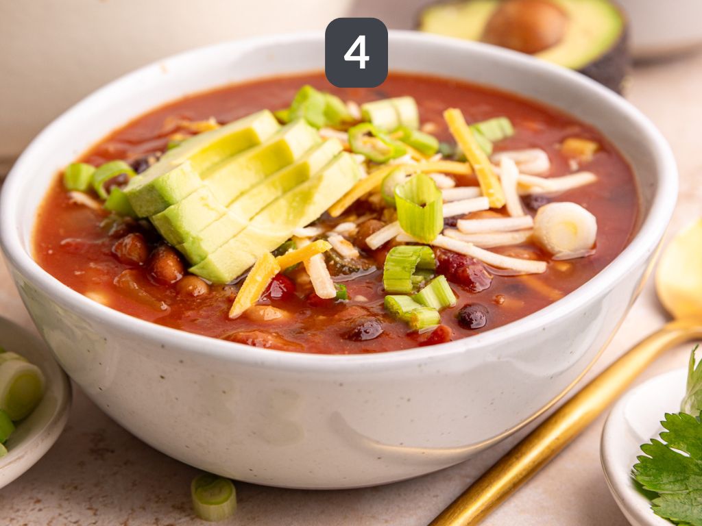 Vegan Five Bean Chili Step 4 - serve with cheese, avocado, and scallions.