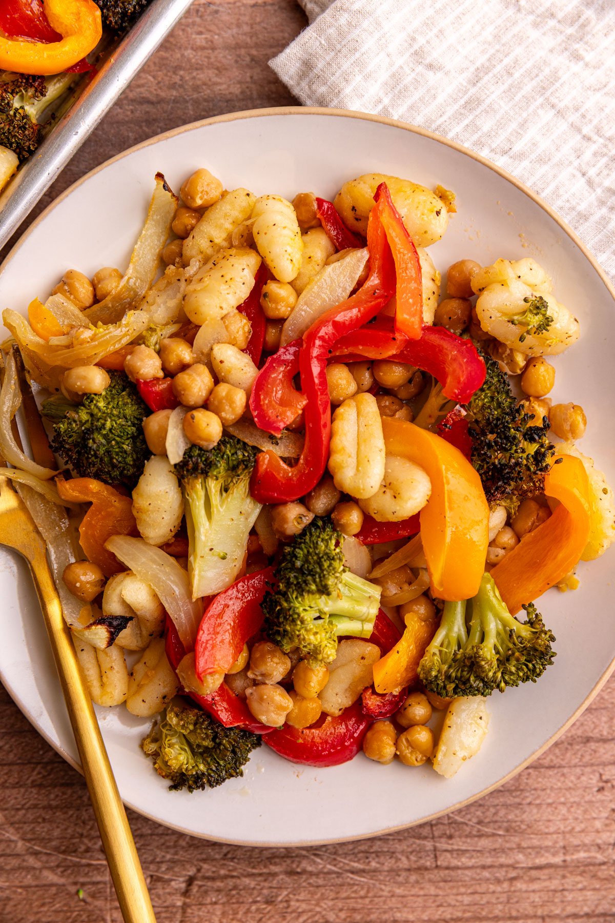 A plate of sheet pan gnocchi, vegetables, and chickpeas.