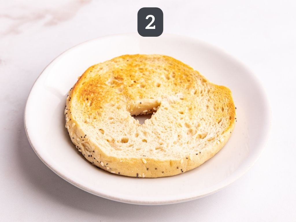 Vegan bagel breakfast sandwich step 2 - toast the bagel.