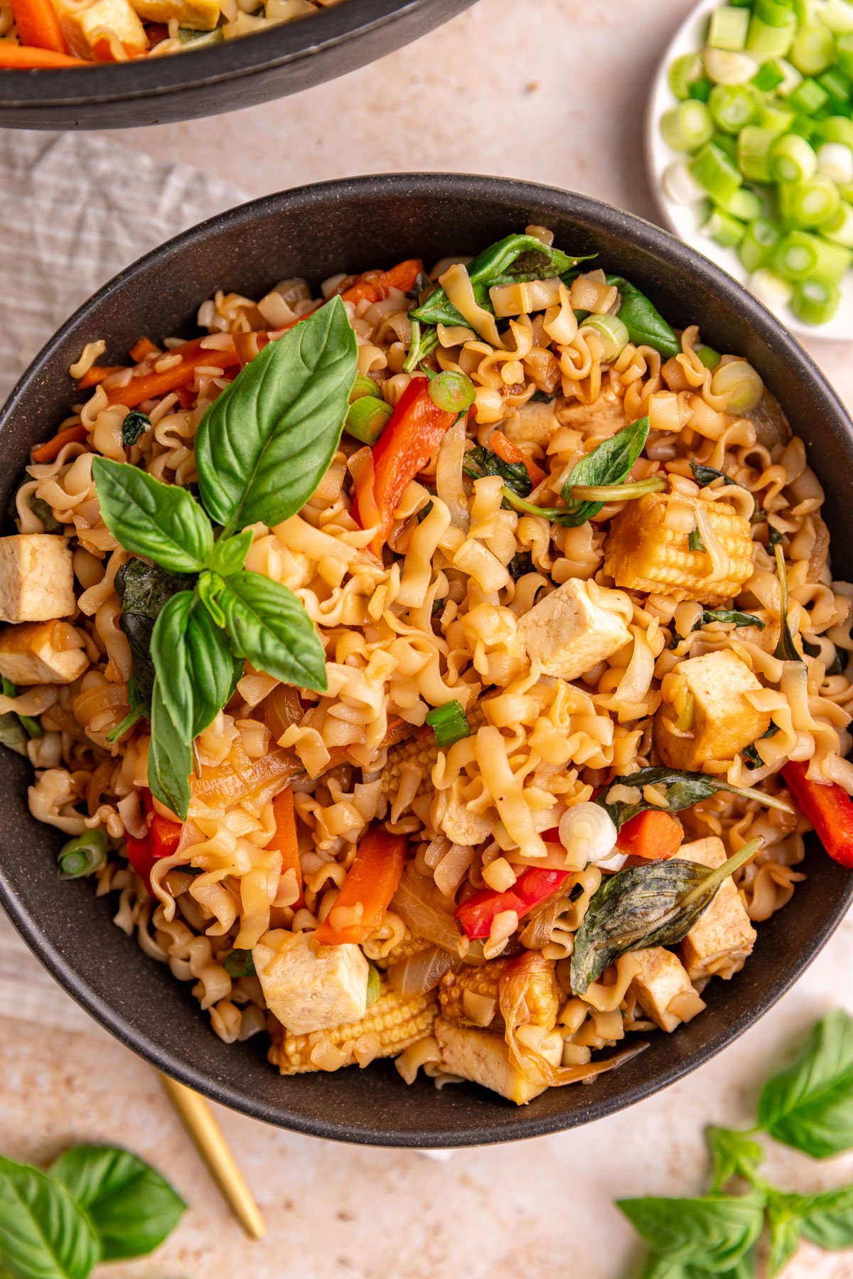 A bowl of vegan drunken noodles, ready to eat.