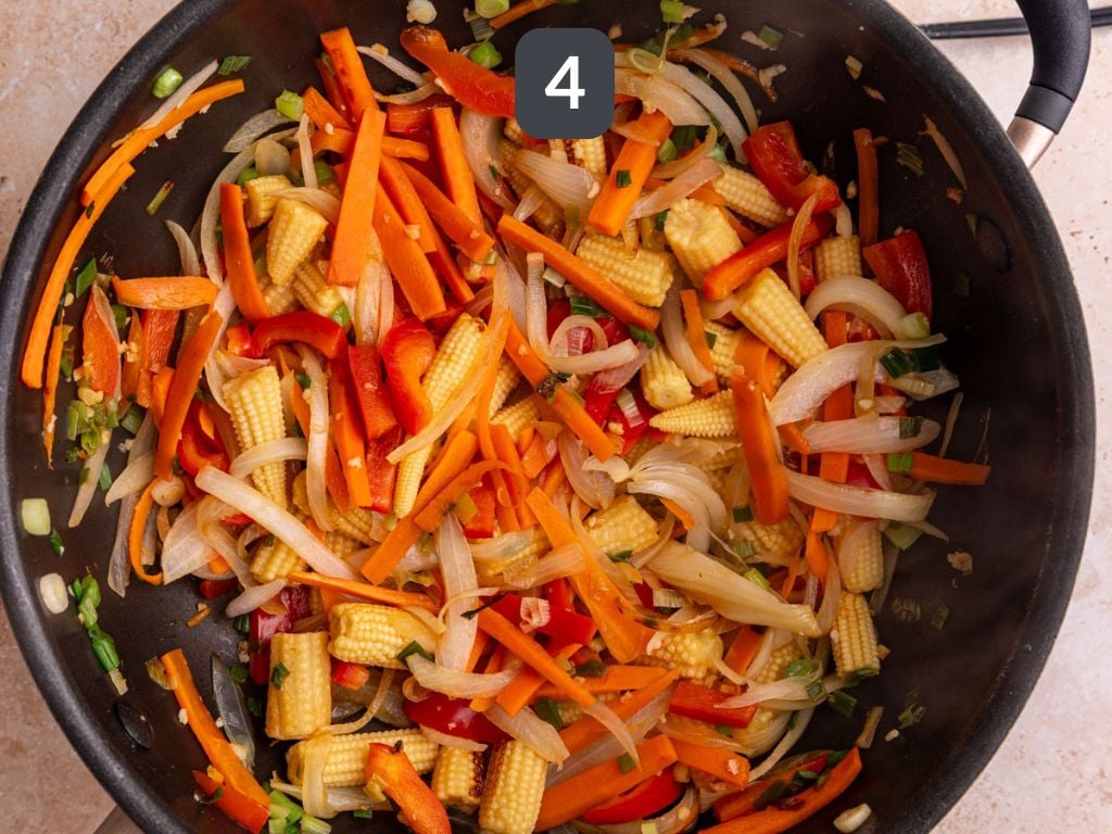 Vegan drunken noodles step 4 - cook the vegetables.
