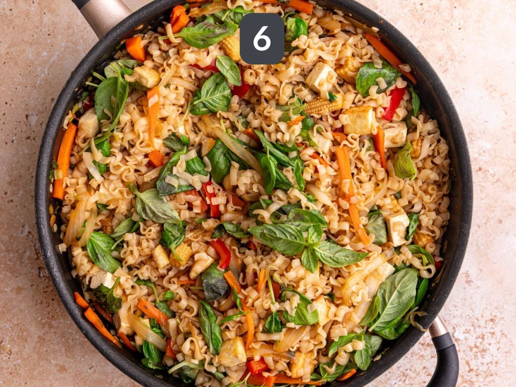Vegan drunken noodles step 6 - stir in the tofu and basil.
