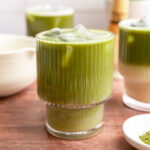 A glass of vegan iced matcha latte.