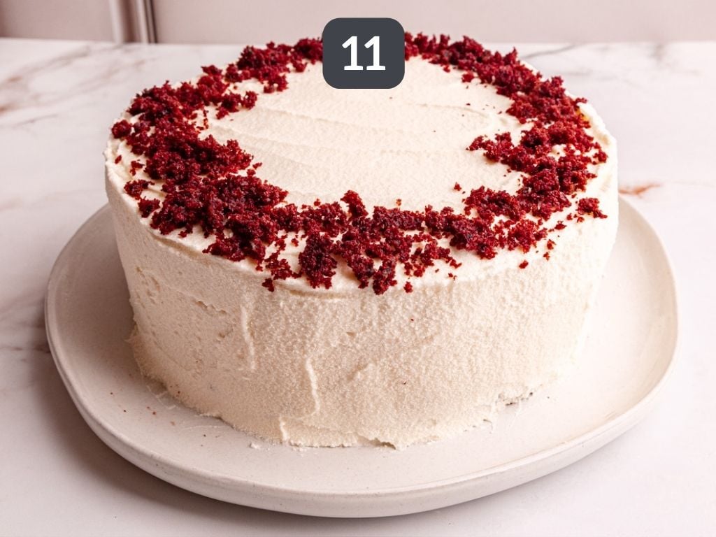 Vegan Red Velvet Cake step 11 - decorate with cake scrap crumbs.