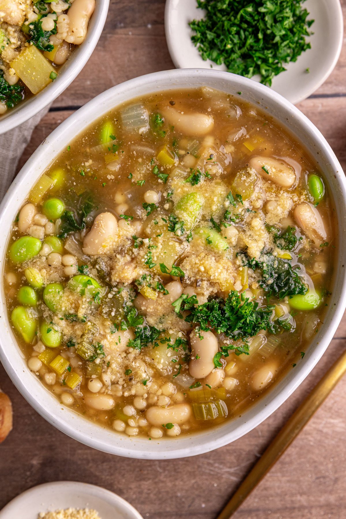A bowl of white minestrone soup.