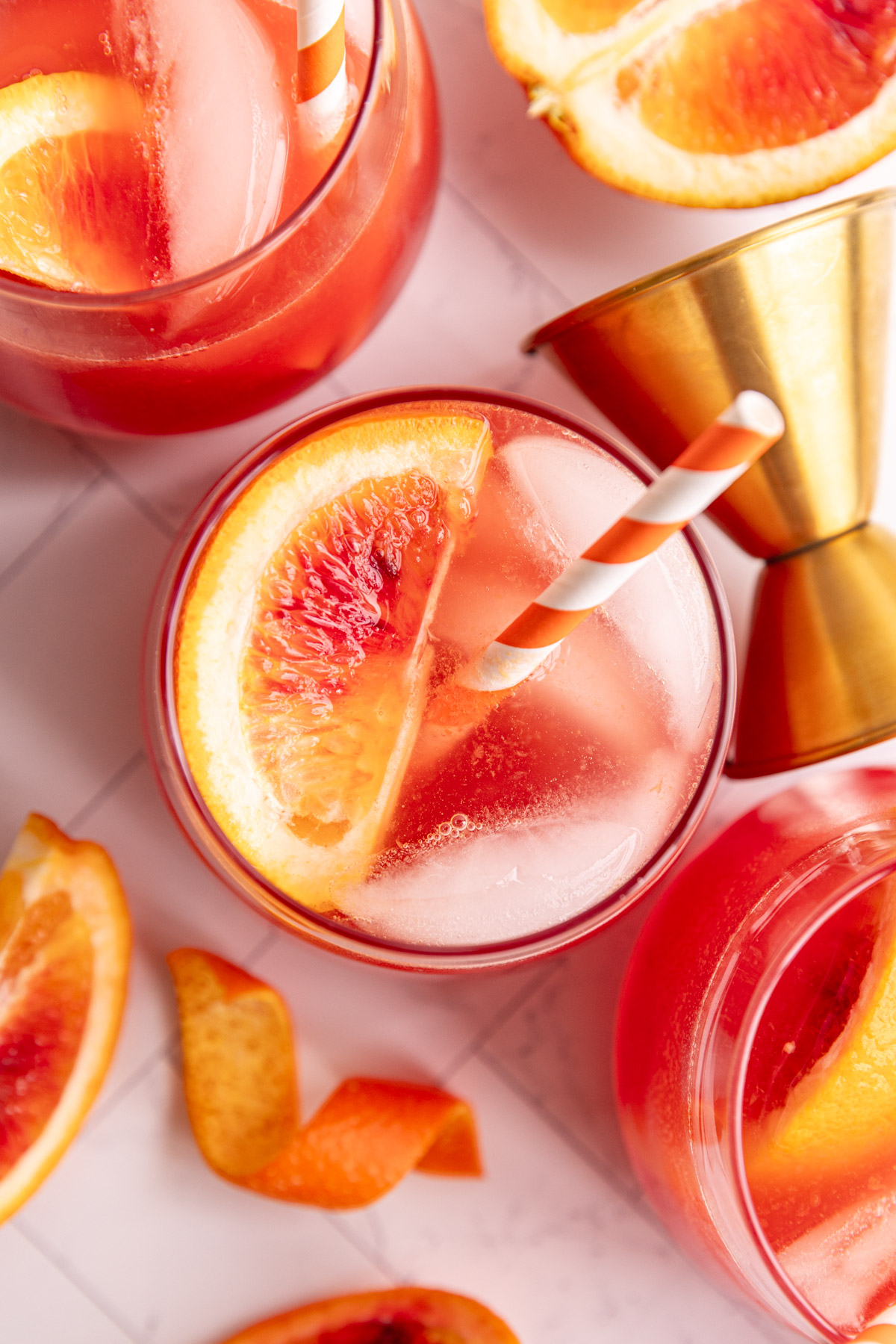 A top-down view of several aperol spritz mocktails.