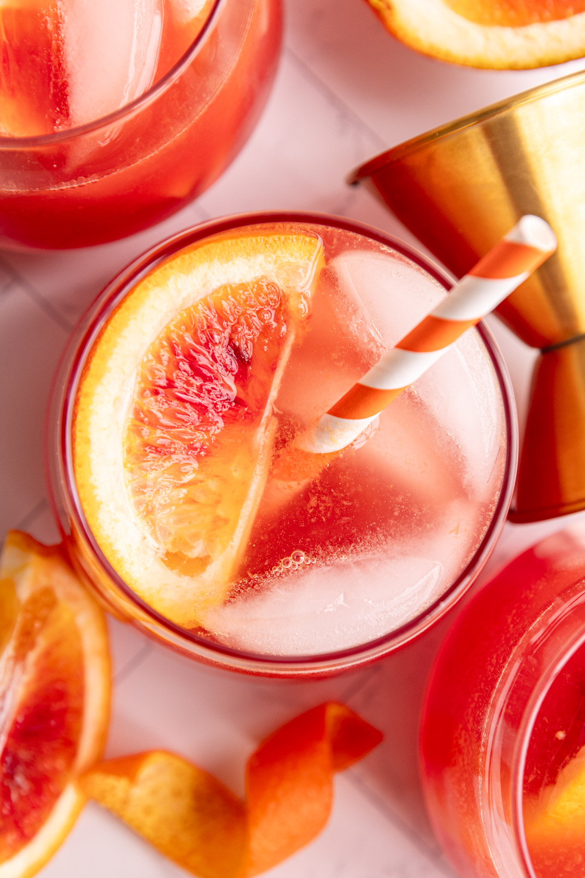 A top-down view of several aperol spritz mocktails.