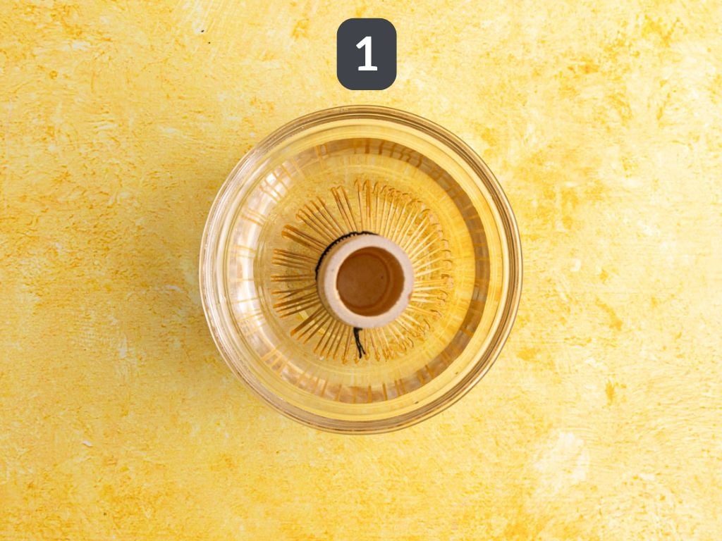 Banana cream matcha latte step 1 - soak the whisk.