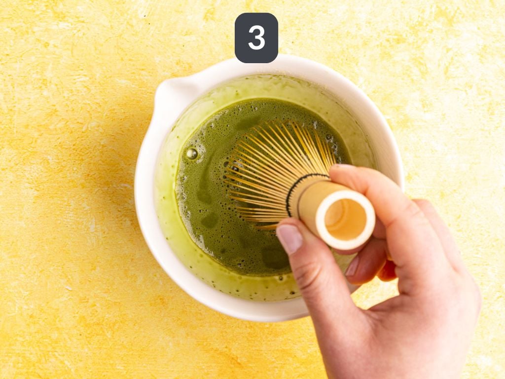 Banana cream matcha latte step 3 - whisk the matcha and hot water.