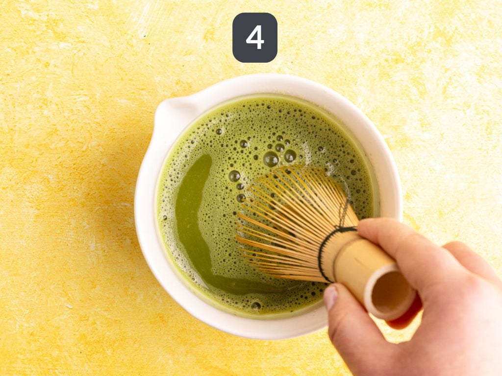 Banana cream matcha latte step 4 - add the remaining water and whisk again.