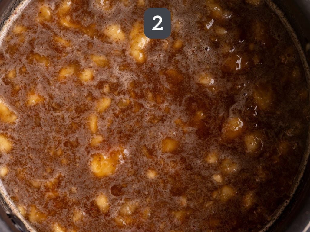 Banana Simple Syrup Step 2 - add the water, sugar, and spices.