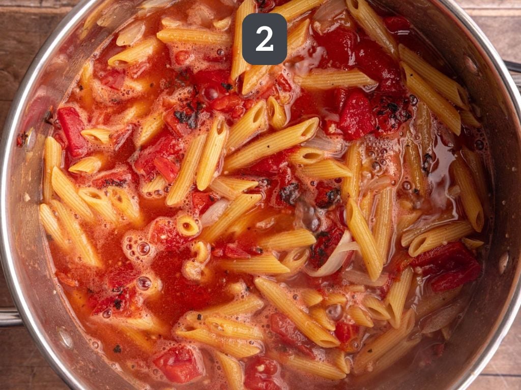 One pot creamy tomato pasta step 2 - add the pasta, tomatoes, and broth and boil