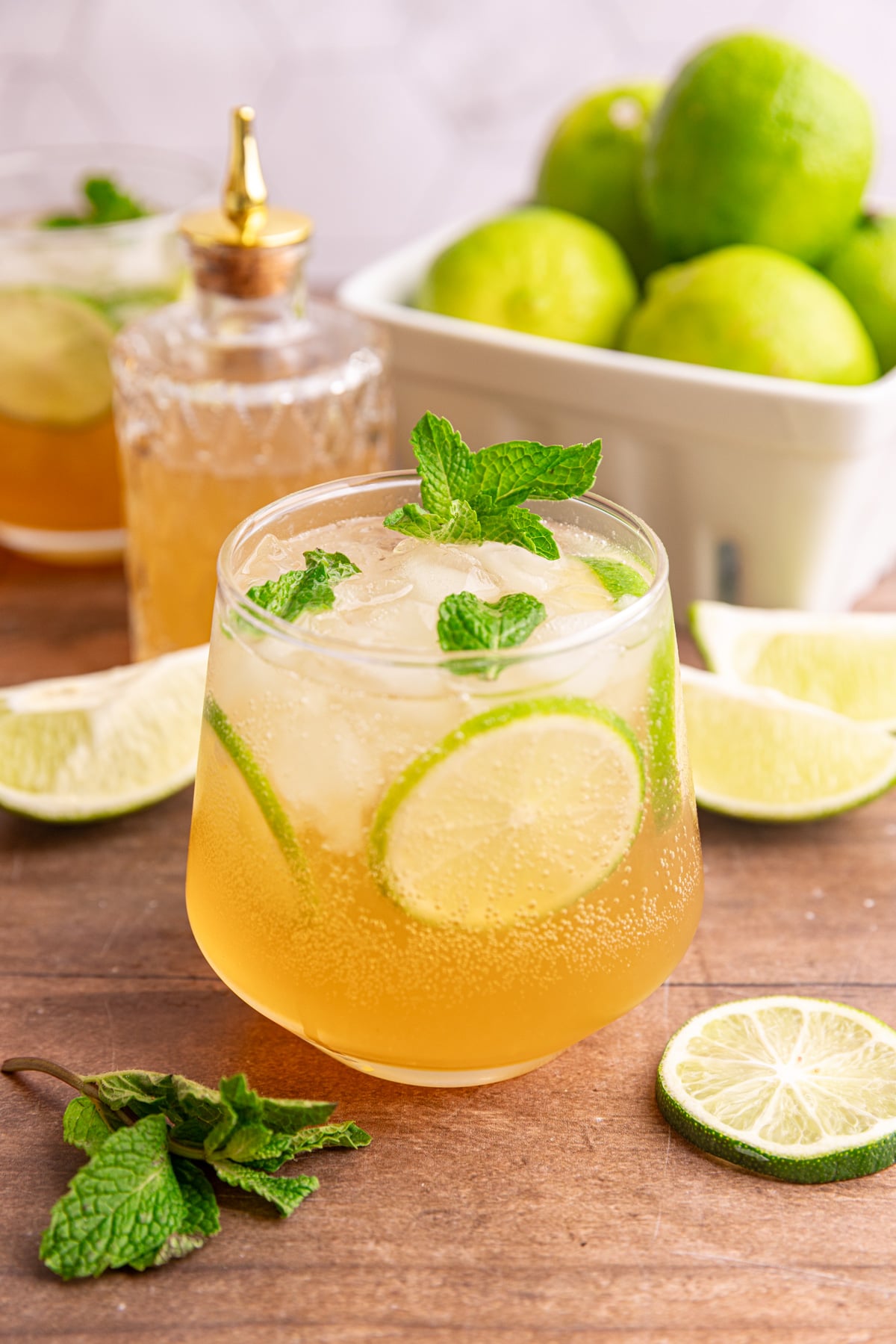 A ginger mojito mocktail, garnished with fresh mint and lime slices.