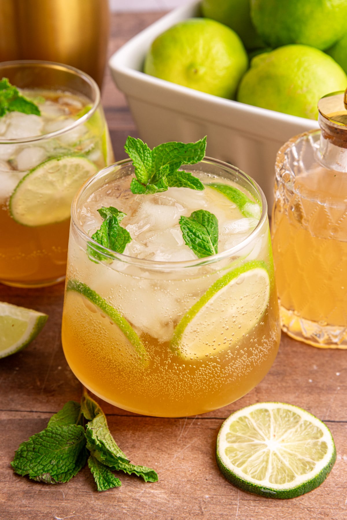 A ginger mojito mocktail, garnished with fresh mint and lime slices.