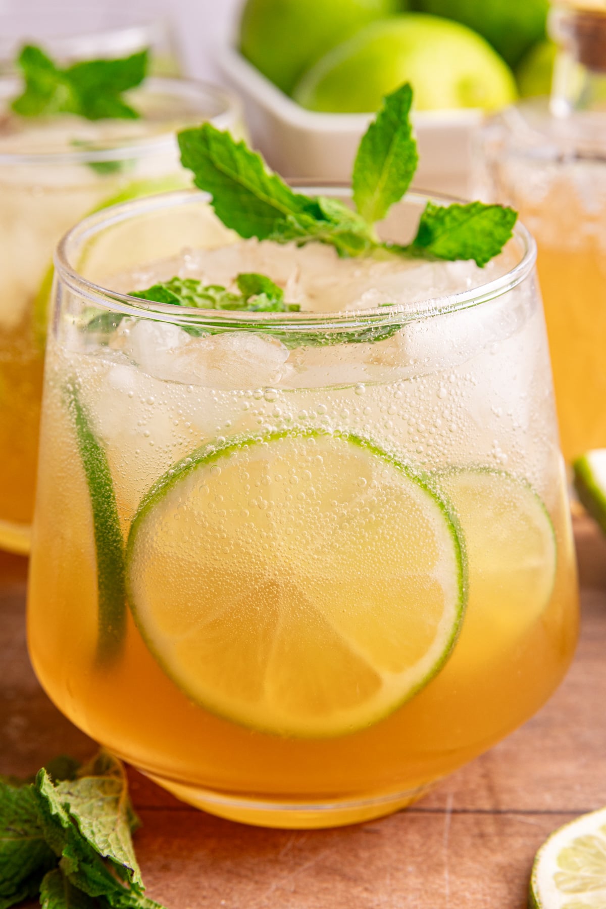 A ginger mojito mocktail, garnished with fresh mint and lime slices.