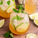 A ginger mojito mocktail, garnished with fresh mint and lime slices.