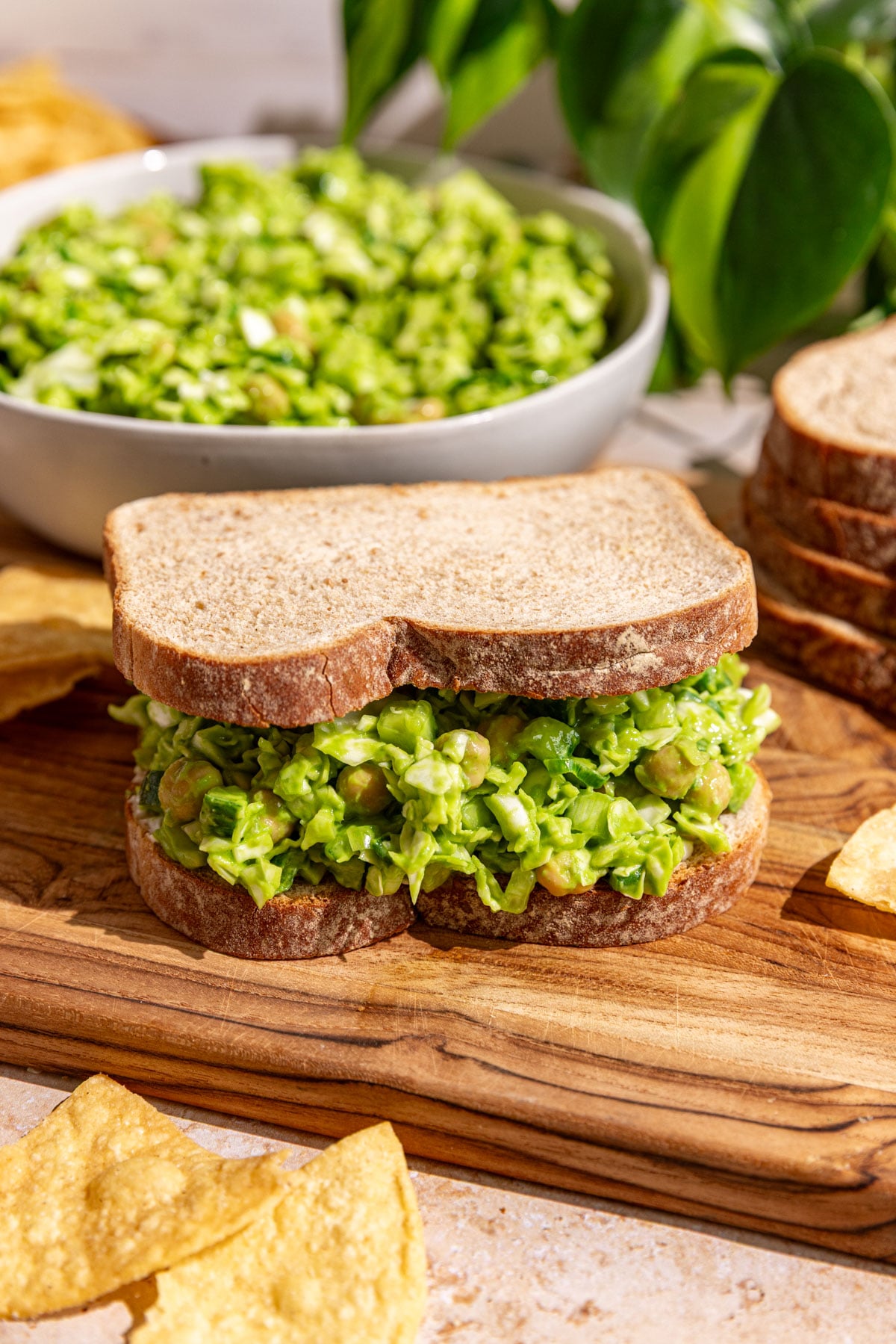 Green goddess salad served on a sandwich.