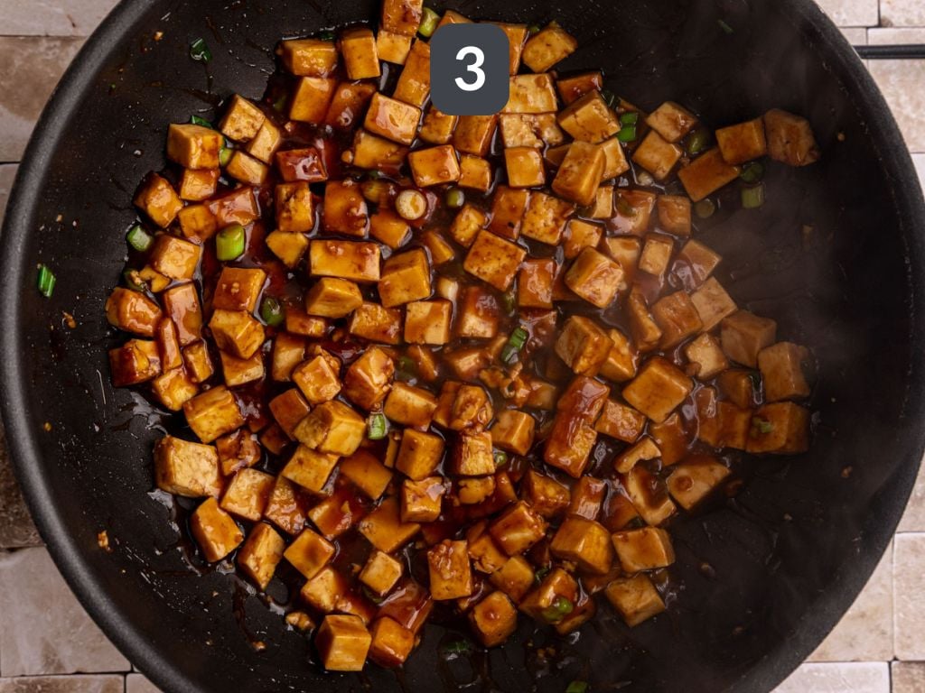 Easy Mongolian Tofu Step 3 - add the sauce and scallions and cook.