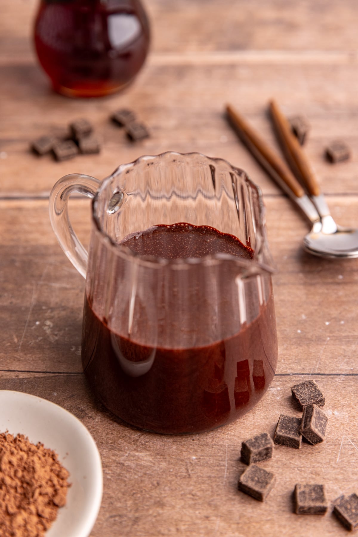 A small pitcher of Maple Chocolate Syrup.