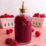 A bottle of raspberry simple syrup.