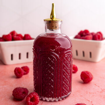 A bottle of raspberry simple syrup.