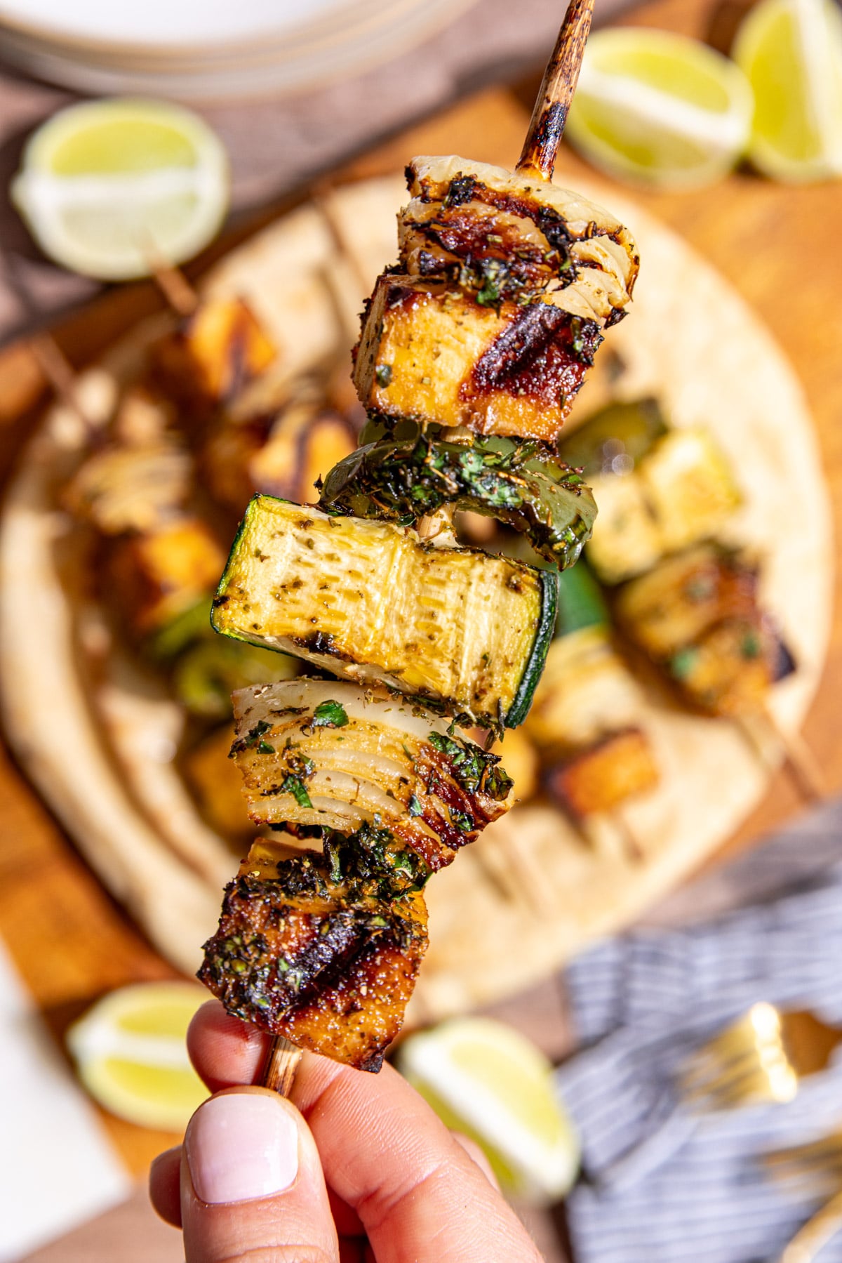 A vegan chicken skewer, with golden brown grill marks.